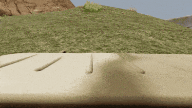 a computer generated image of a grassy hillside with a sandy surface in the foreground