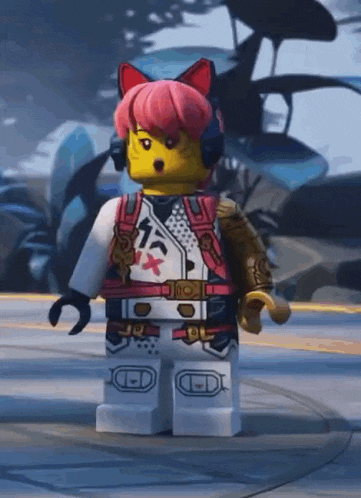 a lego figure with pink hair and headphones is standing on a street .