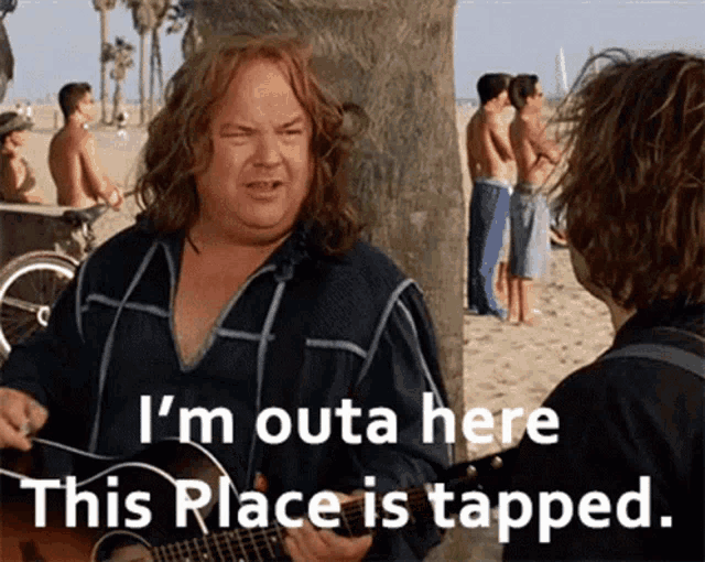 a man playing a guitar on a beach with the words i 'm outa here this place is tapped
