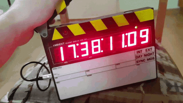 a digital clapper board displays the time as 17:38
