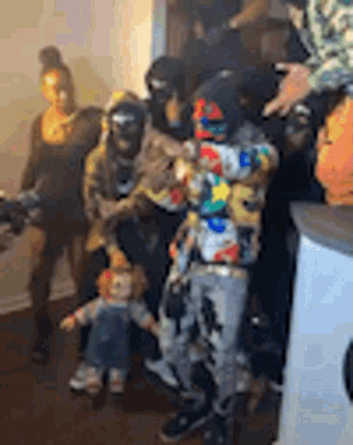 a group of people are standing next to each other in a living room .