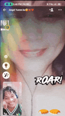 a phone screen shows a girl with headphones and the words roar on it