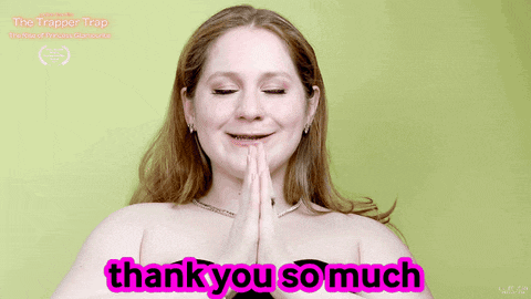 a woman says thank you so much in pink