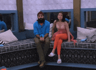 a man and a woman are sitting on a bench