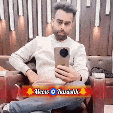 a man taking a selfie with the name meow kanishk on the bottom right