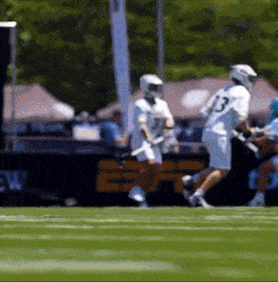 a lacrosse player wearing number 13 is running on the field
