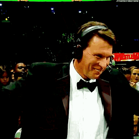 a man in a tuxedo is wearing headphones and the name john bradshaw is on the bottom