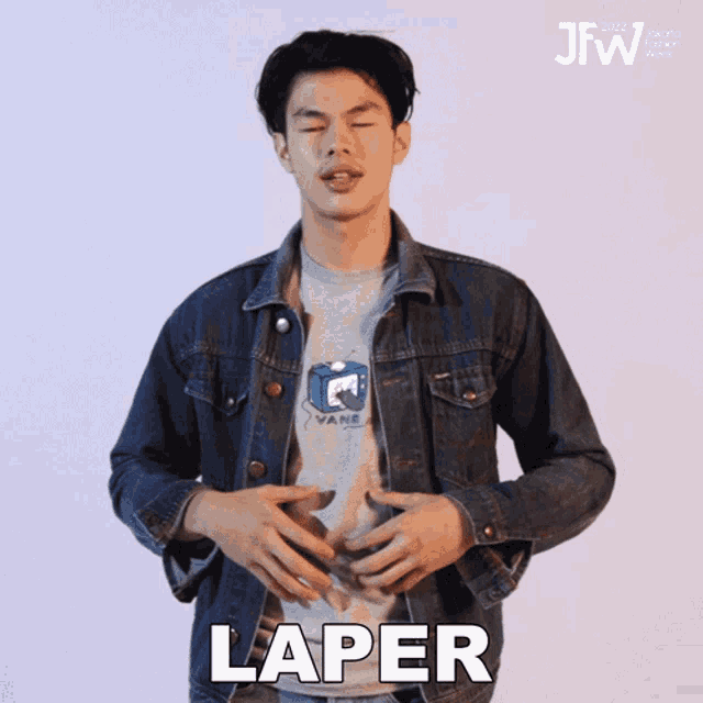 a man in a denim jacket is holding his stomach and says " laper "