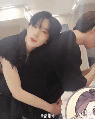 a man and a woman are hugging each other with a motion ninja logo in the background