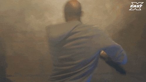 a blurred image of a man with the word fast on the bottom