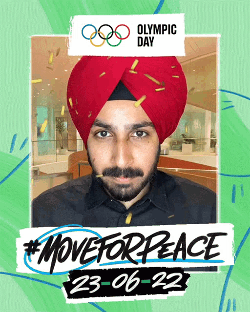 a man wearing a red turban stands in front of an olympic day advertisement