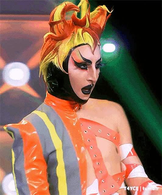 a close up of a person wearing a costume with a mask on their head