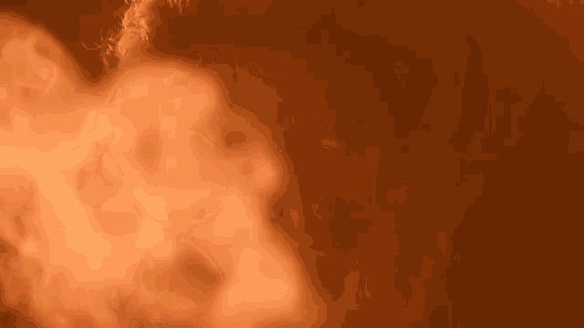 a close up of a fire with smoke coming out of it on a brown background .