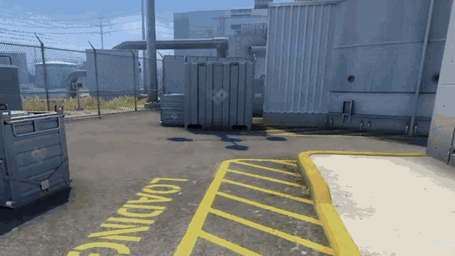 a parking lot with a yellow loading sign on the ground