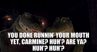 two alligators are standing next to each other in a dark room and they are talking about running their mouths .