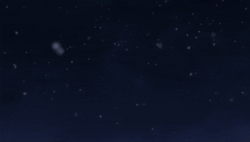 a man in a black shirt is standing in the snow