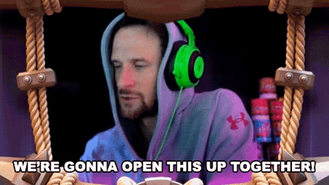 a man wearing headphones with the words " we 're gonna open this up together " above him