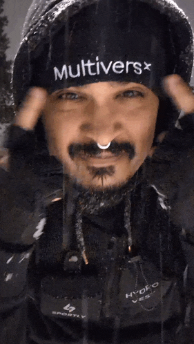a man wearing a black hat that says multiverse on it