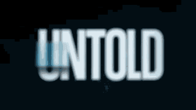 a blurred image of the word untold on a black background
