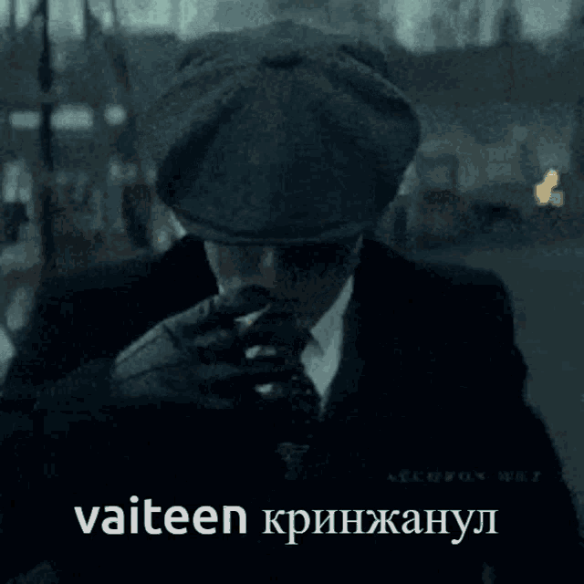 a man in a suit and tie is wearing a hat that says " vaiteen " on it