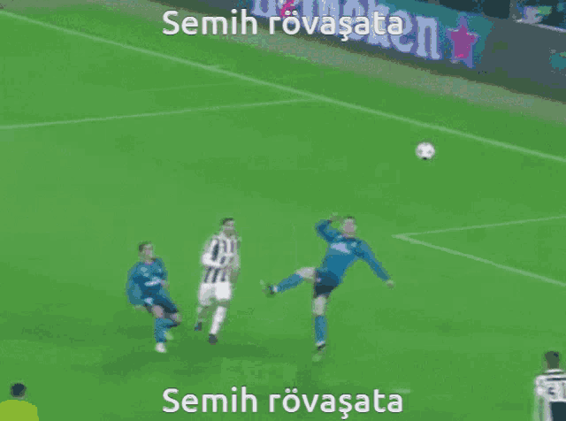 a soccer field with a sign that says semih rovasata on it