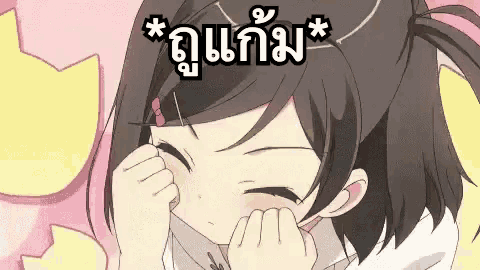 a cartoon girl is covering her face with her hands and a cat is behind her .