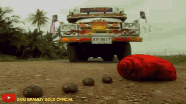 a gmm grammy gold official video shows a car on a dirt road