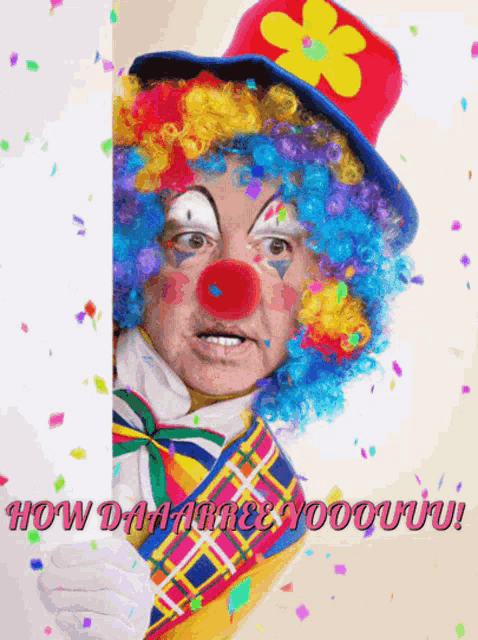 a man dressed as a clown holds a sign that says how dare you