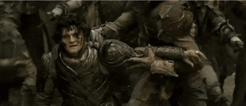 a man is holding another man 's neck and says `` dwarves . ''