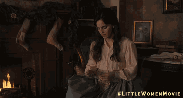 a poster for the little women movie shows a woman holding a pillow over her face