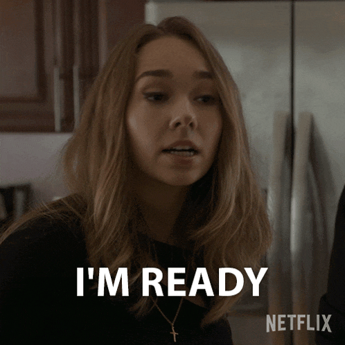 a woman says " i 'm ready " in front of a refrigerator