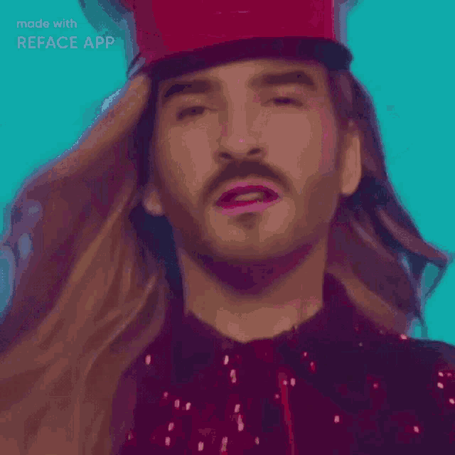 a man with long hair and a beard is wearing a red hat .