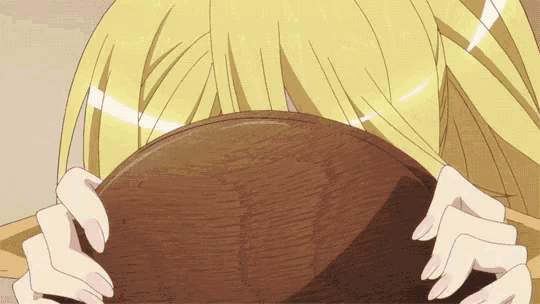 a girl with blonde hair is holding a brown bowl