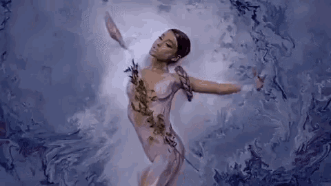 a naked woman is dancing in the water with her arms outstretched in a painting .