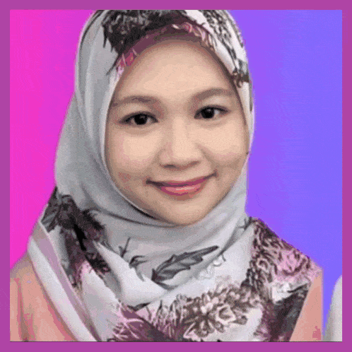 a woman wearing a hijab and a scarf is smiling for the camera