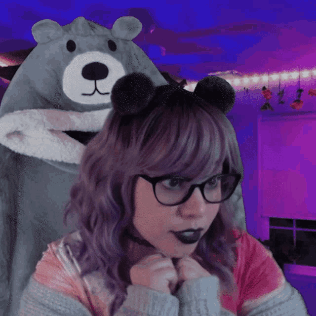 a woman wearing glasses and a bear costume