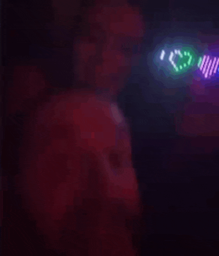 a man wearing a pair of glow in the dark glasses that say i love you