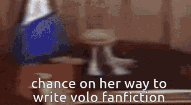 a blurry picture of a man in a suit and tie with the words " chance on her way to write volo fanfiction "