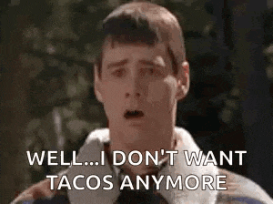 a man is making a funny face and saying `` well ... i don t want tacos anymore '' .