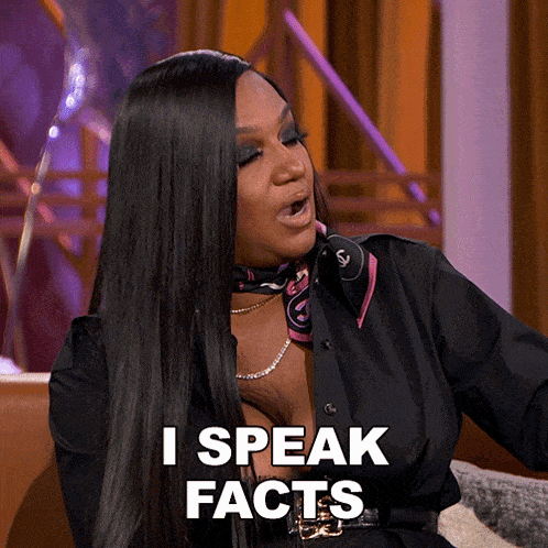 a woman sitting on a couch with her mouth open says i speak facts