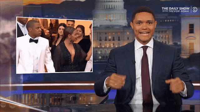 a man in a suit and tie is on a show called the daily show
