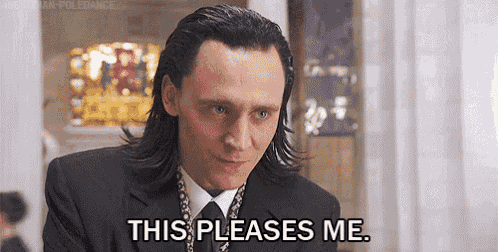 loki from avengers : age of ultron is wearing a suit and tie and saying `` this pleases me '' .