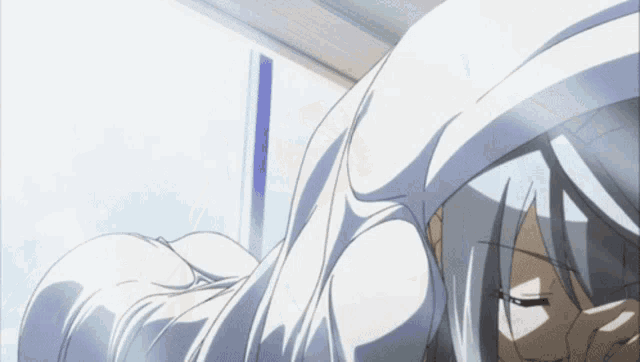 a girl with long white hair is laying on her back with her eyes closed