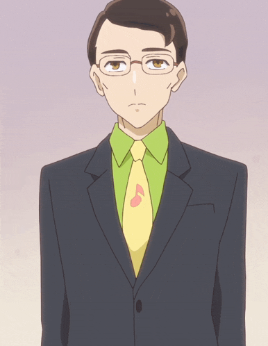 a man in a suit and tie with a music note on his necktie