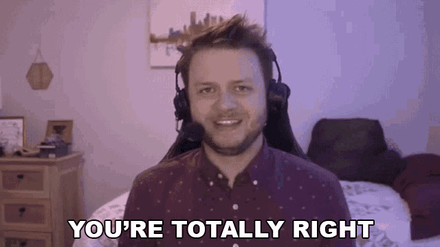 a man wearing headphones is sitting in a chair and saying `` you 're totally right ''
