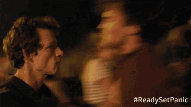 a blurry picture of a crowd with the hashtag #readysetpanic on the bottom