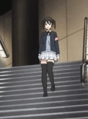 a girl is walking up a set of stairs .