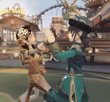 a couple of people dancing in front of a roller coaster that says first base