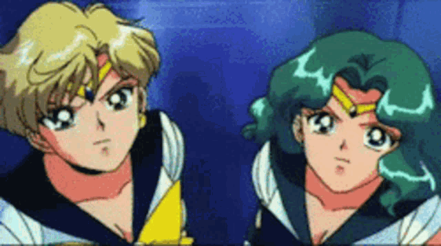 a couple of anime characters are standing next to each other and looking at the camera