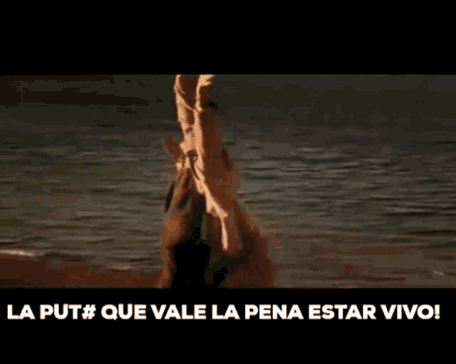 a man is standing in the water with the words la put que vale la pena estar vivo